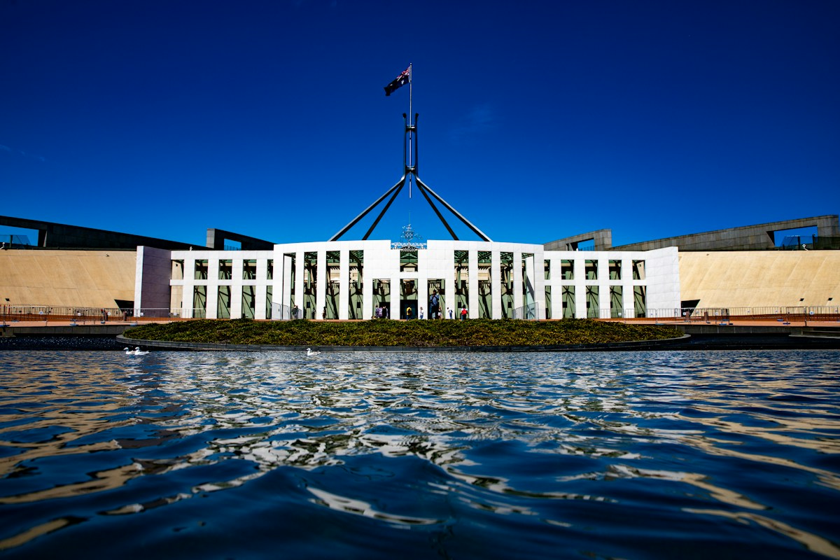 Parliament House in Canberra with the Australian flag on top